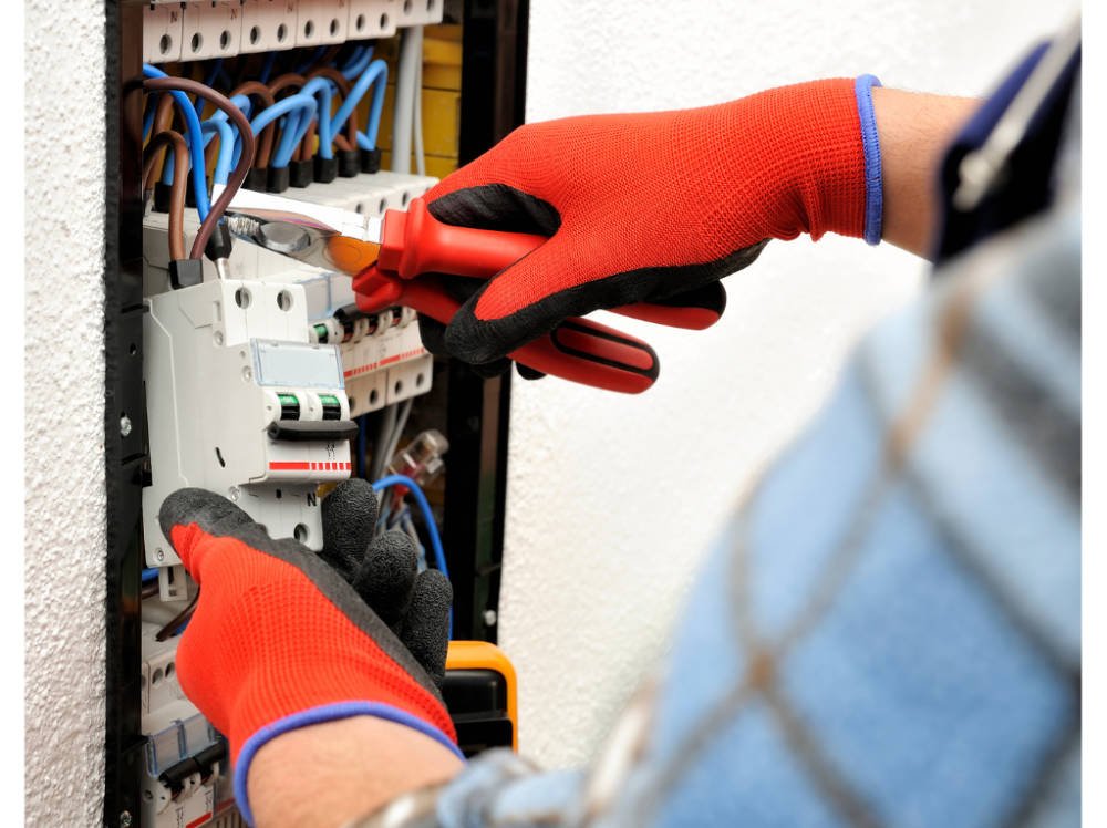 Someone working on an electrical panel